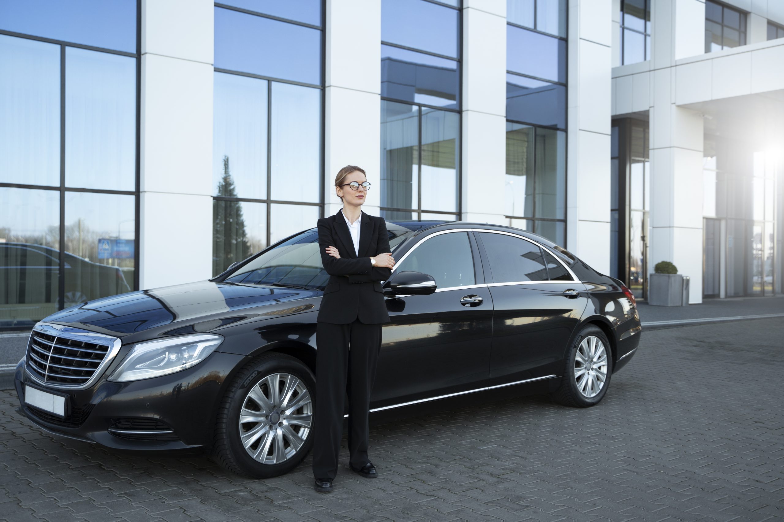 Worker Standing Next to Car