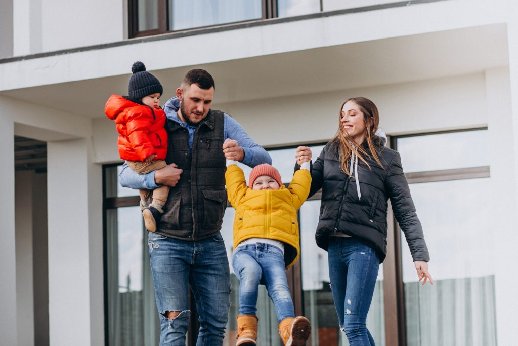 Family Playing outside of their home